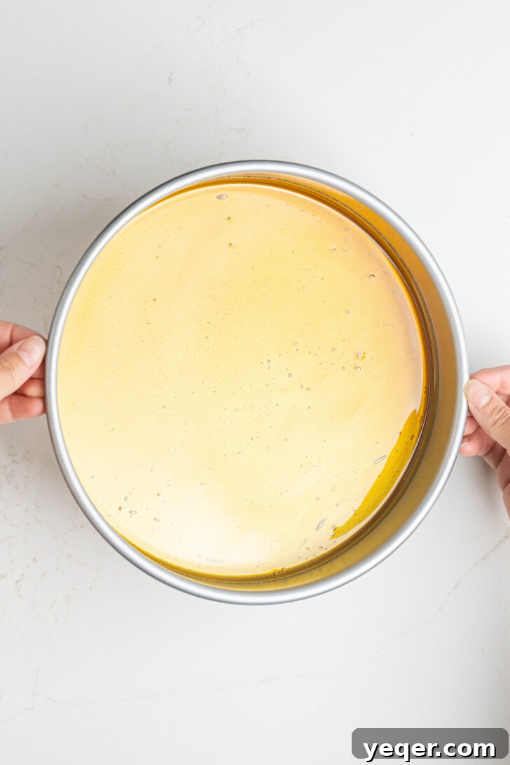 Golden Pumpkin Caramel Flan 6 Freshly poured caramel coating the bottom of a round baking dish.