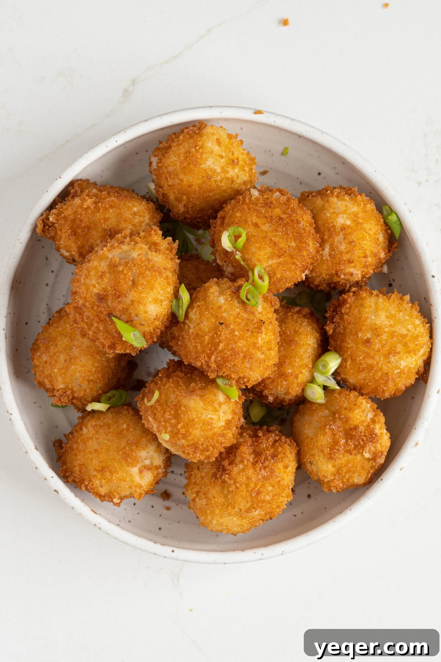 Golden Ham Croquettes 2 Golden-brown Croquetas de Jamón served in a rustic bowl, ready to be enjoyed as a classic Spanish appetizer.