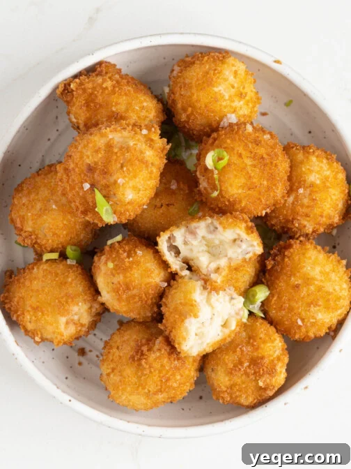 Golden-brown Croquetas de Jamón served in a rustic bowl, ready to be enjoyed.