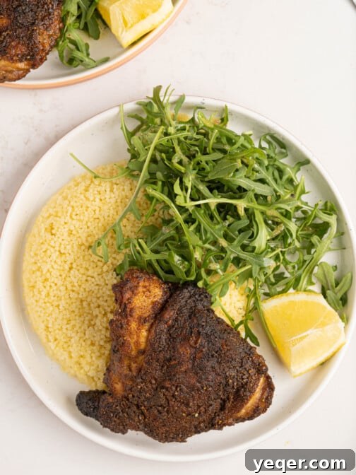 A delicious roasted Ras el Hanout chicken thigh, ready to be served, highlighting its succulent texture and aromatic spices.