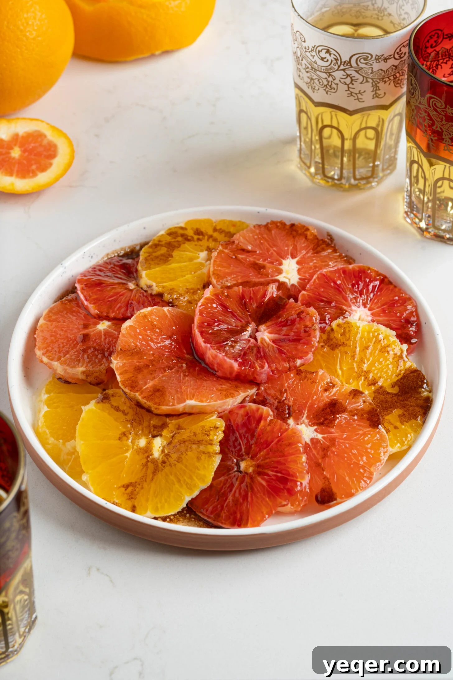 Quick Moroccan Orange Salad with Cinnamon Spice 9 A beautifully presented Moroccan orange salad next to traditional Moroccan tea glasses.