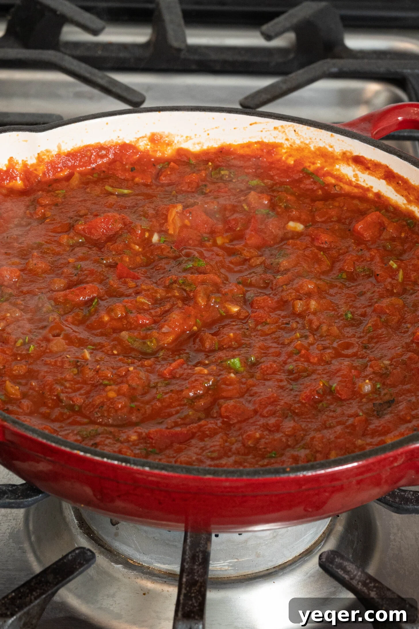 Speedy Moroccan Shakshuka 14 tomato sauce in a pan on a stovetop