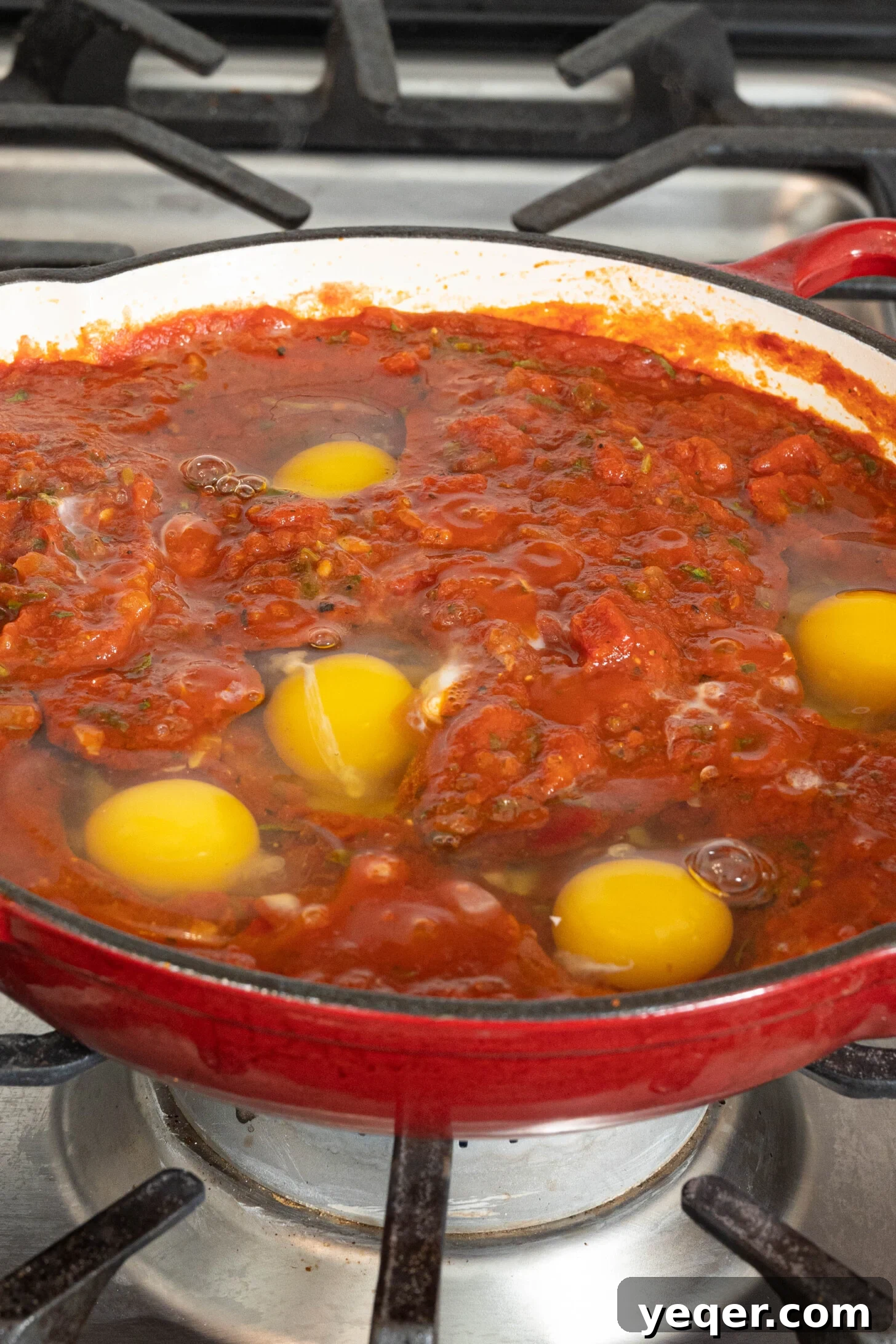 Speedy Moroccan Shakshuka 15 eggs in tomato sauce in a pan
