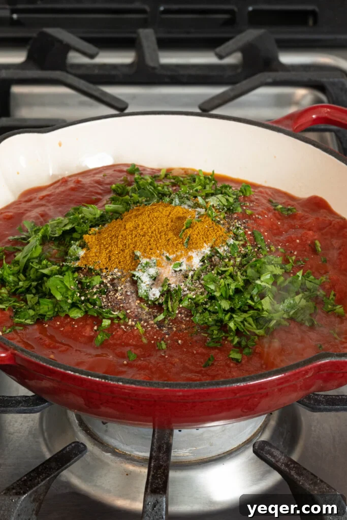 Speedy Moroccan Shakshuka 6 tomato sauce with herbs and spices in a pan