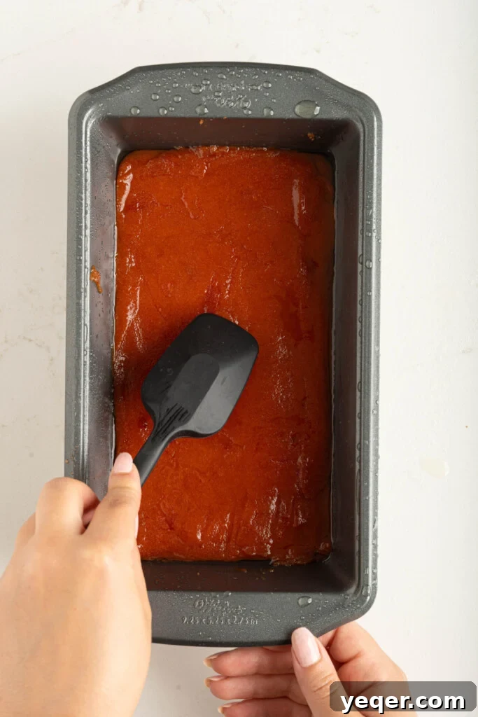 Four Ingredient Guava Paste Made Easy 10 a spatula smoothing out guava paste