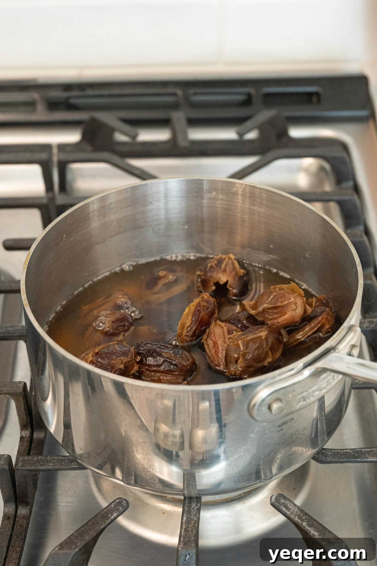 Pure Date Nectar 15 Dates steeping in a pot of water