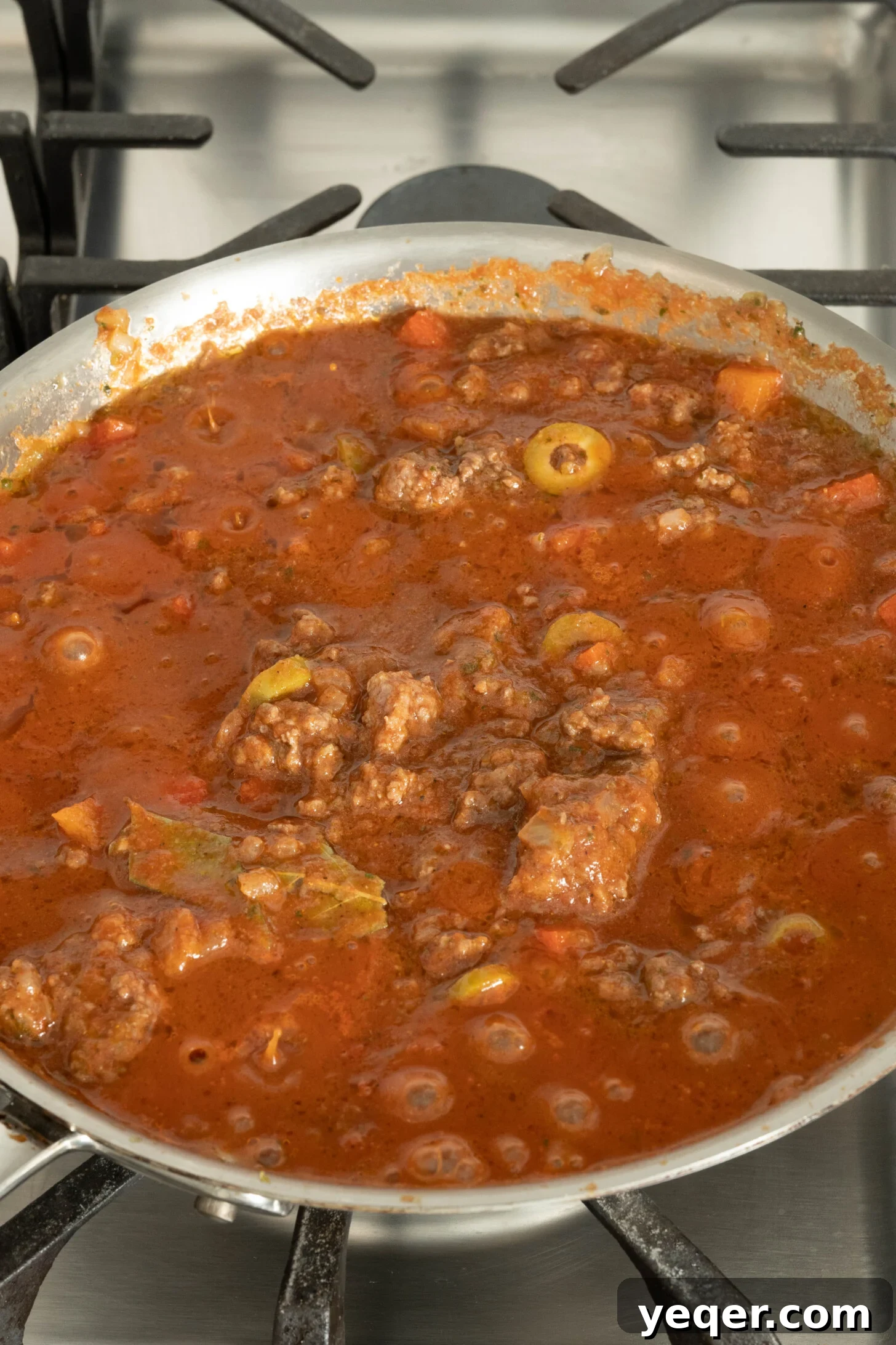 Caramelized Plantain Lasagna 5 picadillo in a pan on a stovetop