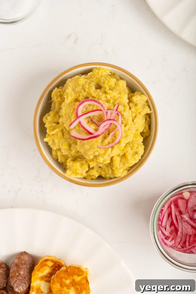 Whip Up Dominican Mangu in 30 Minutes 6 Pickled red onions being sautéed in a saucepan, turning translucent.