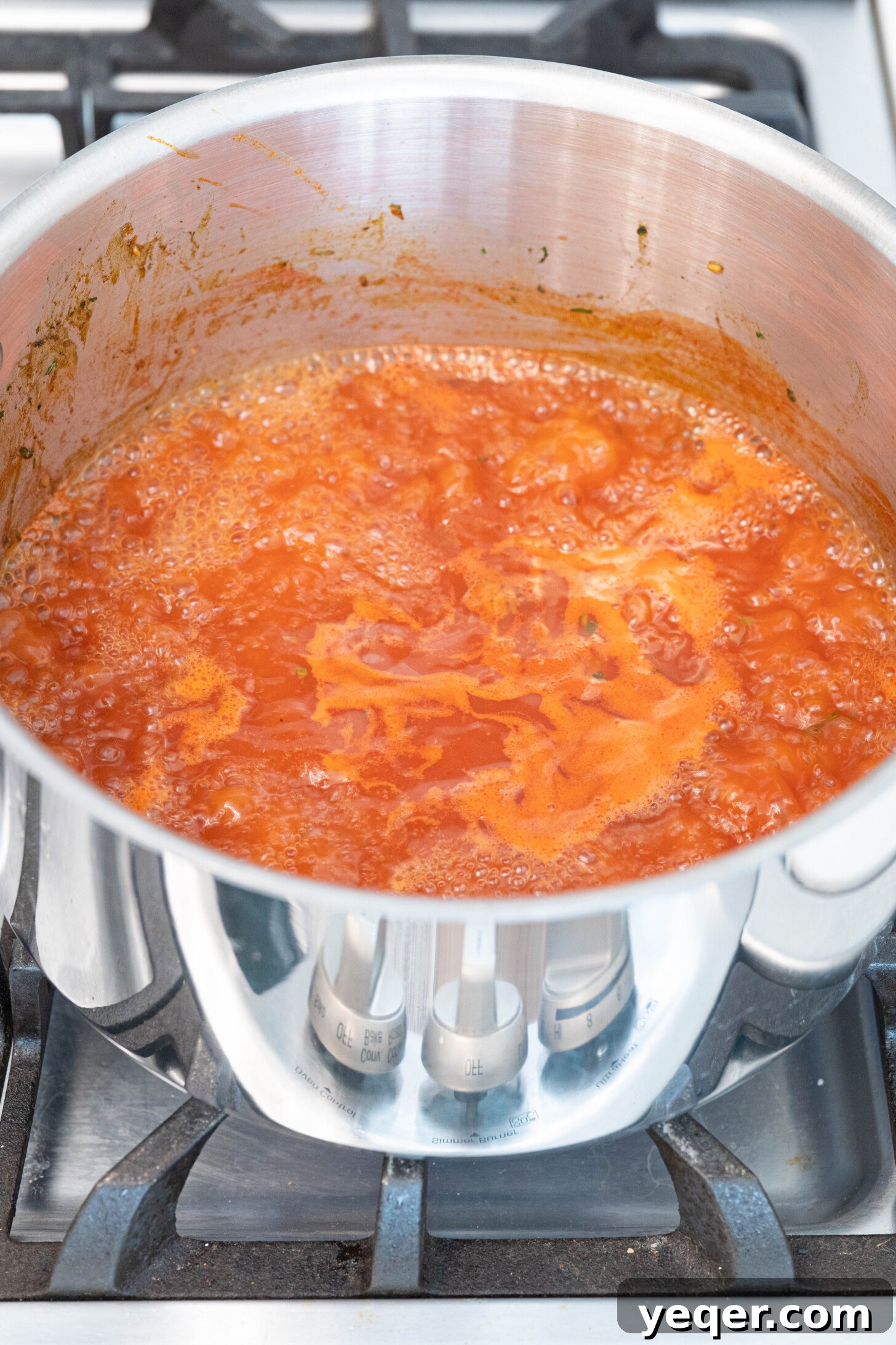 Moroccan Lamb Orzo Pilaf 7 The large pot with the tomato sauce and orzo pasta simmering, absorbing the liquid and becoming tender.