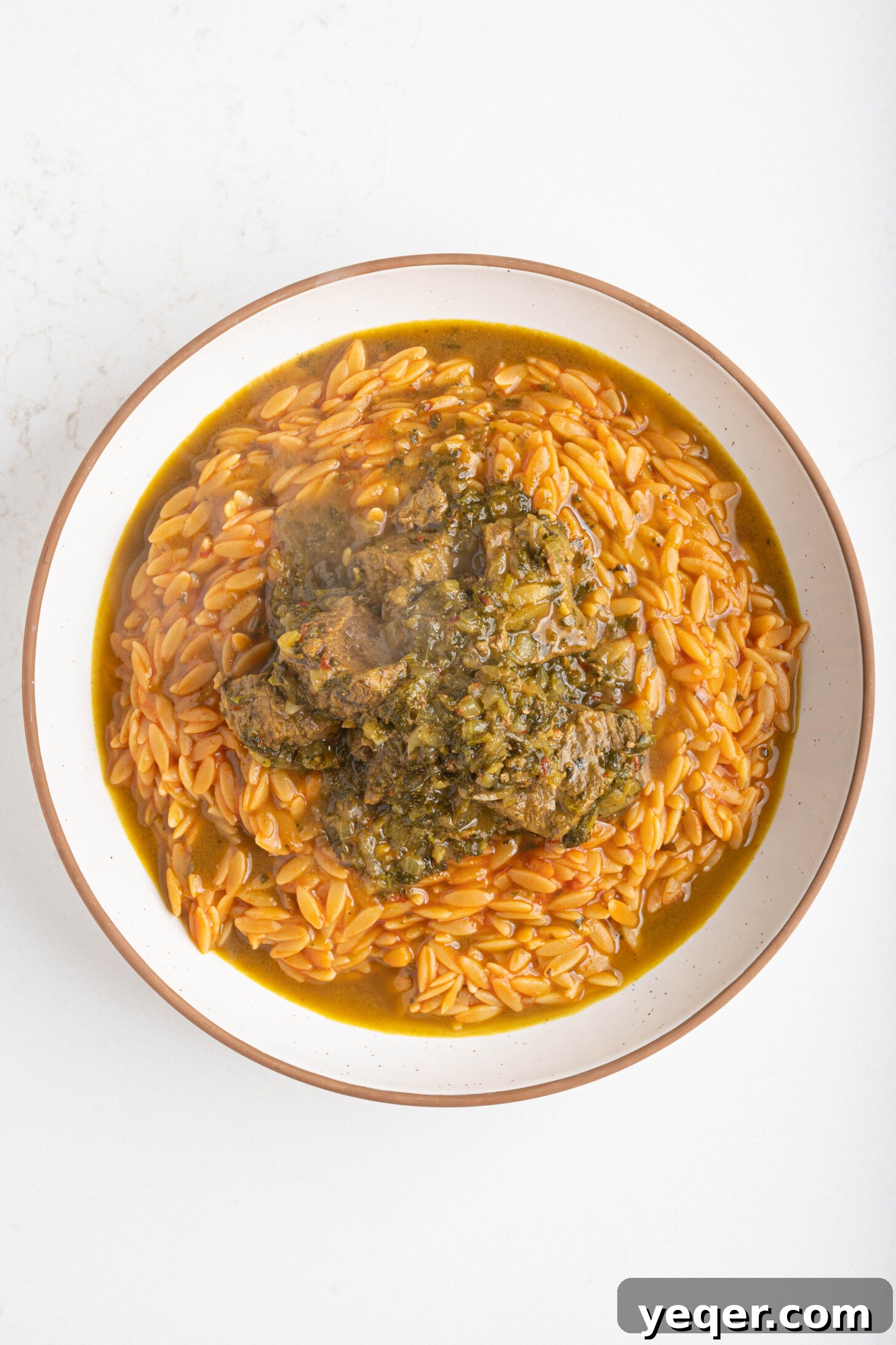 Moroccan Lamb Orzo Pilaf 9 A finished bowl of Moroccan orzo with lamb, garnished and ready to be enjoyed.