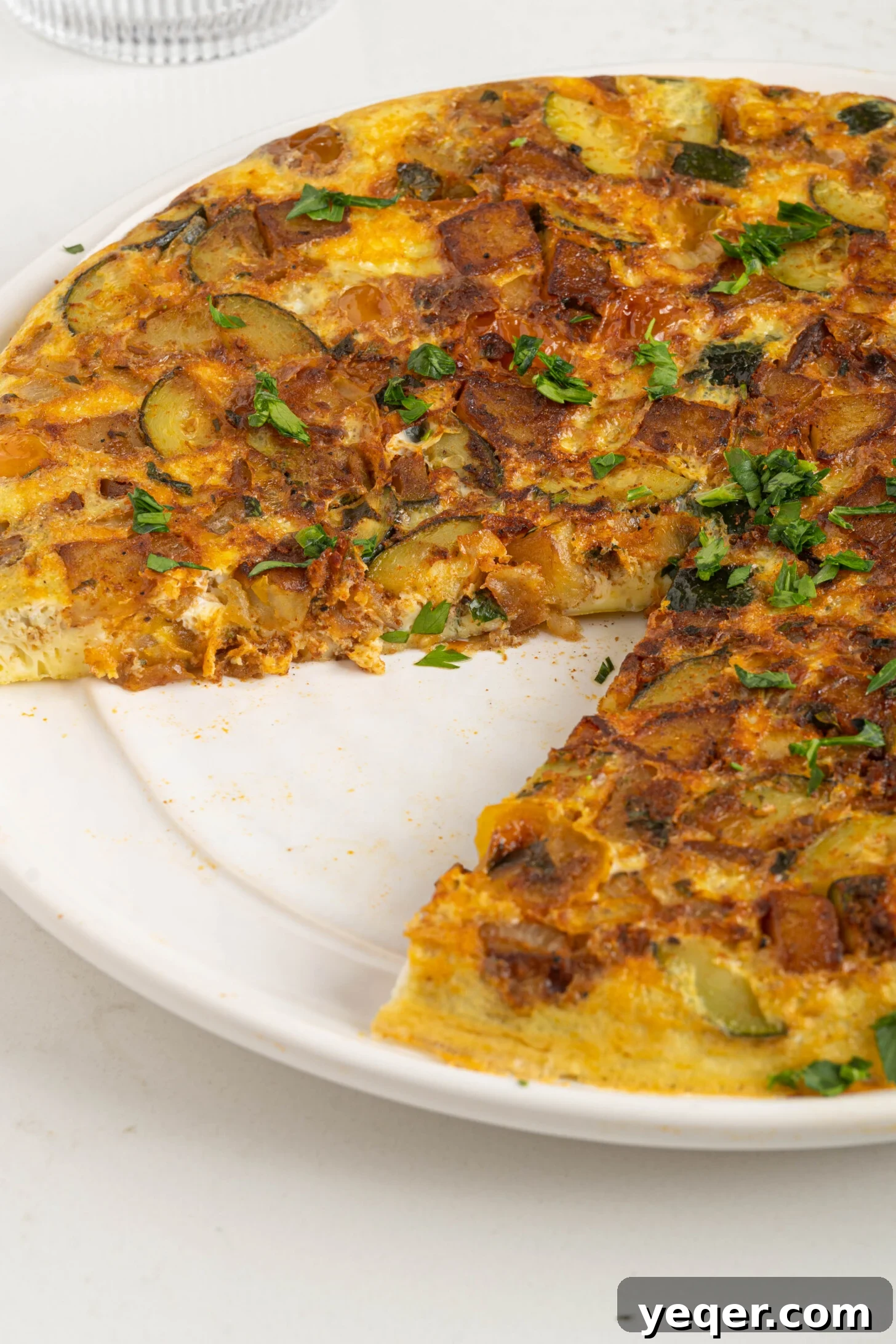 Moroccan Golden Potato Frittata 11 a close-up of a Moroccan potato omelette, showcasing its fluffy texture and rich golden crust