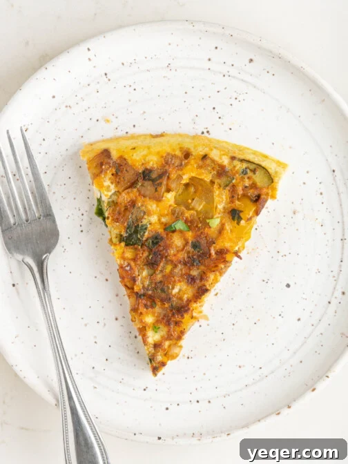 a slice of a potato omelette, showing its delicious layers