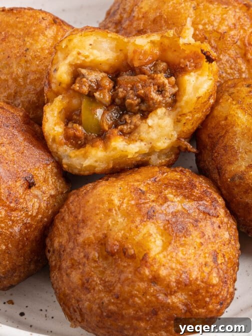 A plate of golden-brown Papas Rellenas, showcasing their delicious texture.