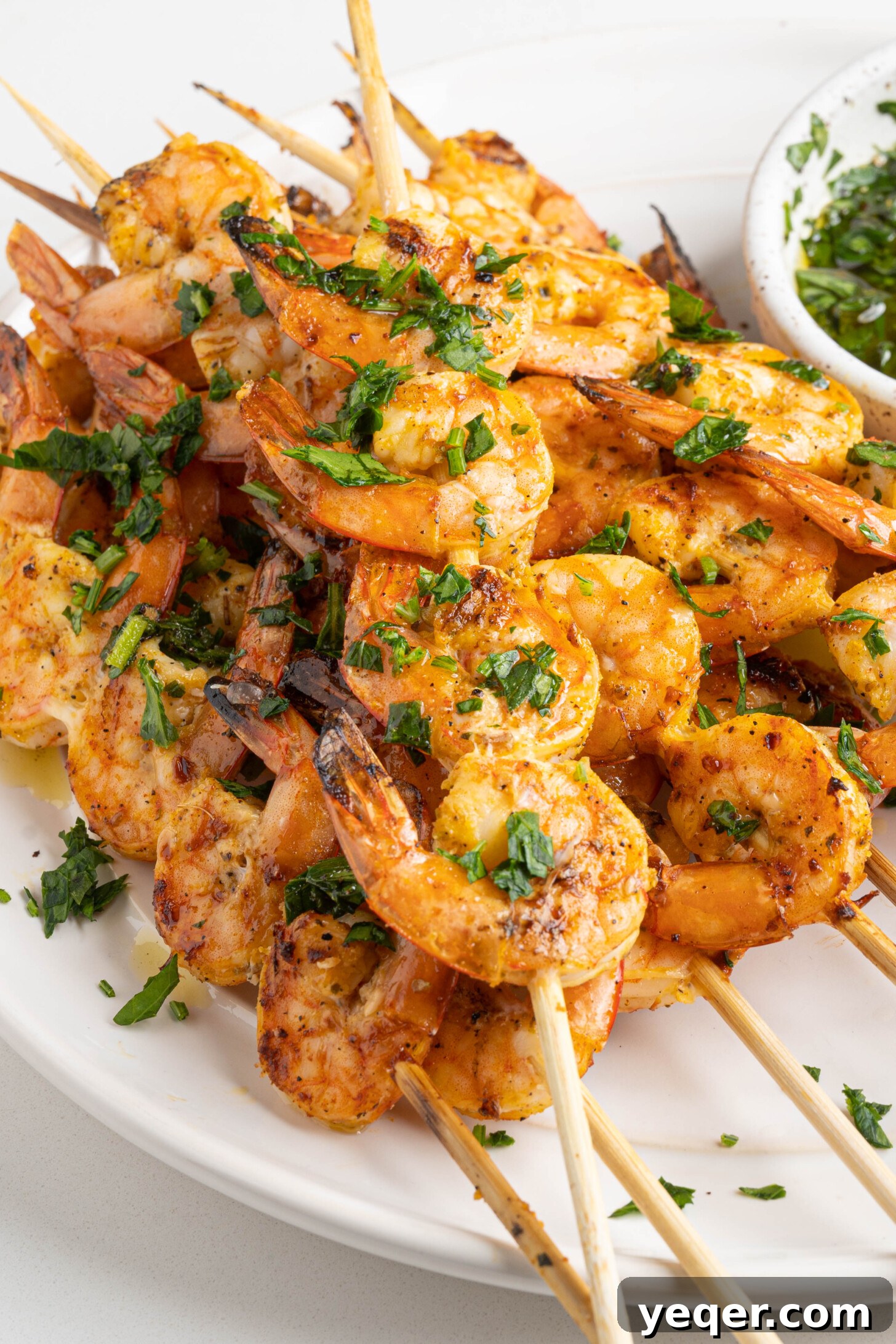 Simply Delicious 5 Ingredient Grilled Shrimp Skewers 10 A vibrant platter of grilled shrimp skewers, artfully arranged and garnished with fresh lemon wedges and parsley, ready for a feast.