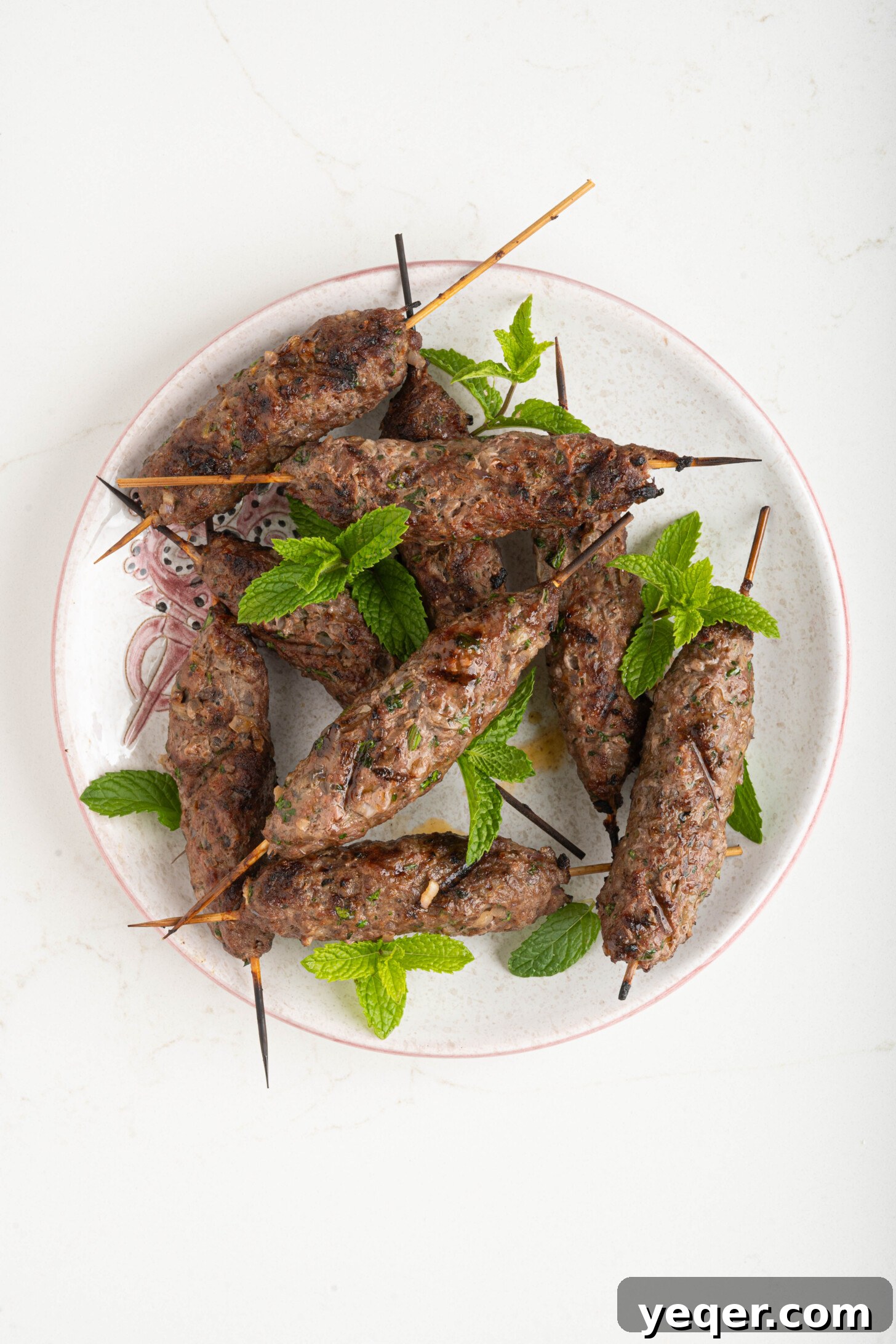 Sizzling Moroccan Kefta in 30 Minutes 8 A vibrant plate of grilled Moroccan kefta, garnished with fresh parsley and ready to be served.