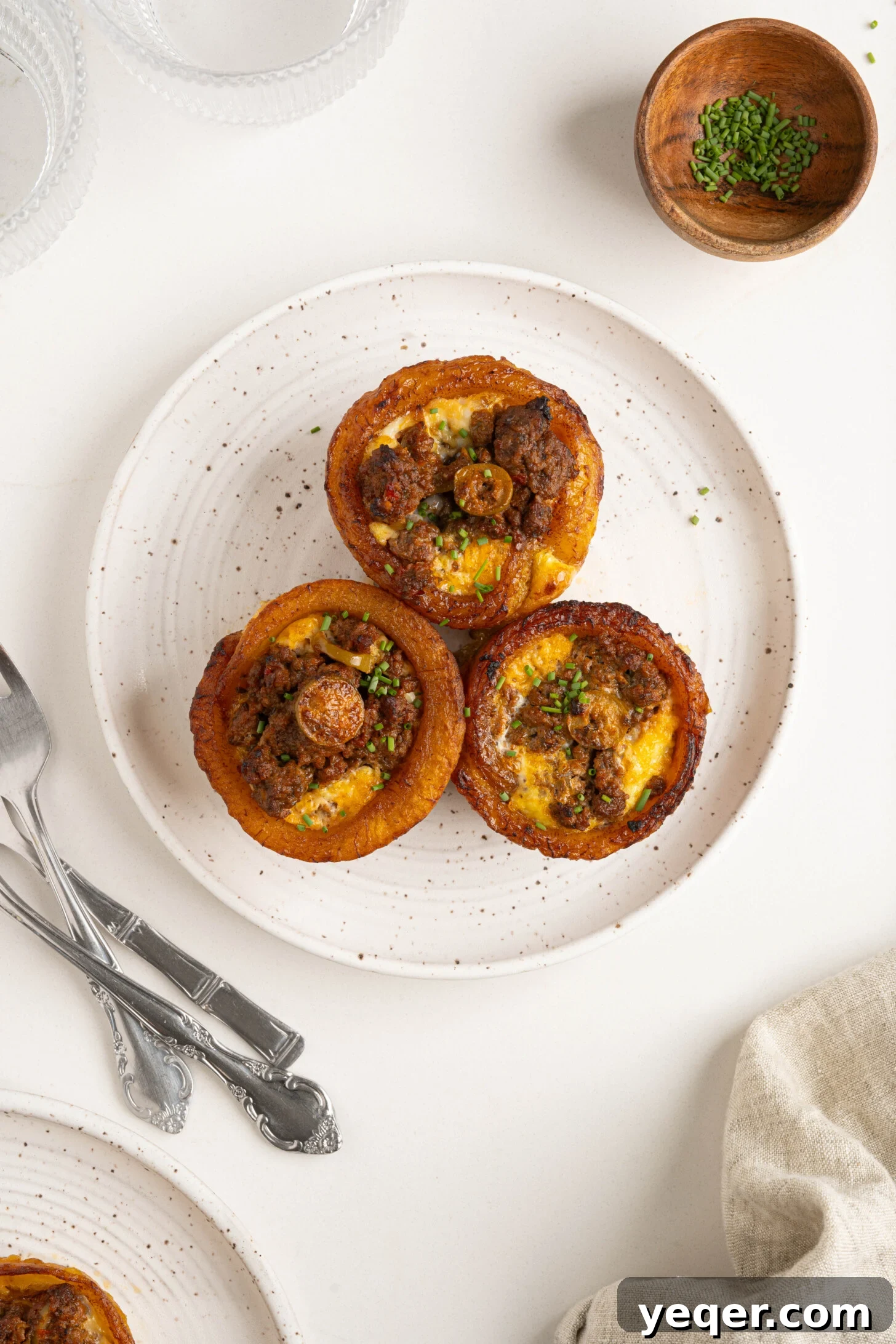 Puerto Rican Stuffed Plantain Cups 11 A plate of freshly baked Puerto Rican Piononos, with a clear view of the picadillo and egg filling.
