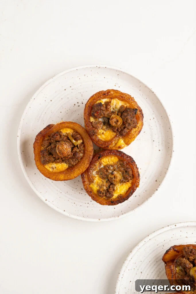 Puerto Rican Stuffed Plantain Cups 9 A plate of freshly baked Puerto Rican Piononos, garnished and ready to be served.