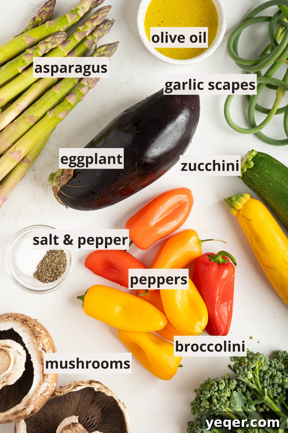 Effortless Grilled Vegetables: 3-Ingredient Marinade 3 An assortment of fresh, raw vegetables including peppers, asparagus, and eggplant, along with bottles of olive oil, salt, and pepper on a kitchen counter, ready for preparation.