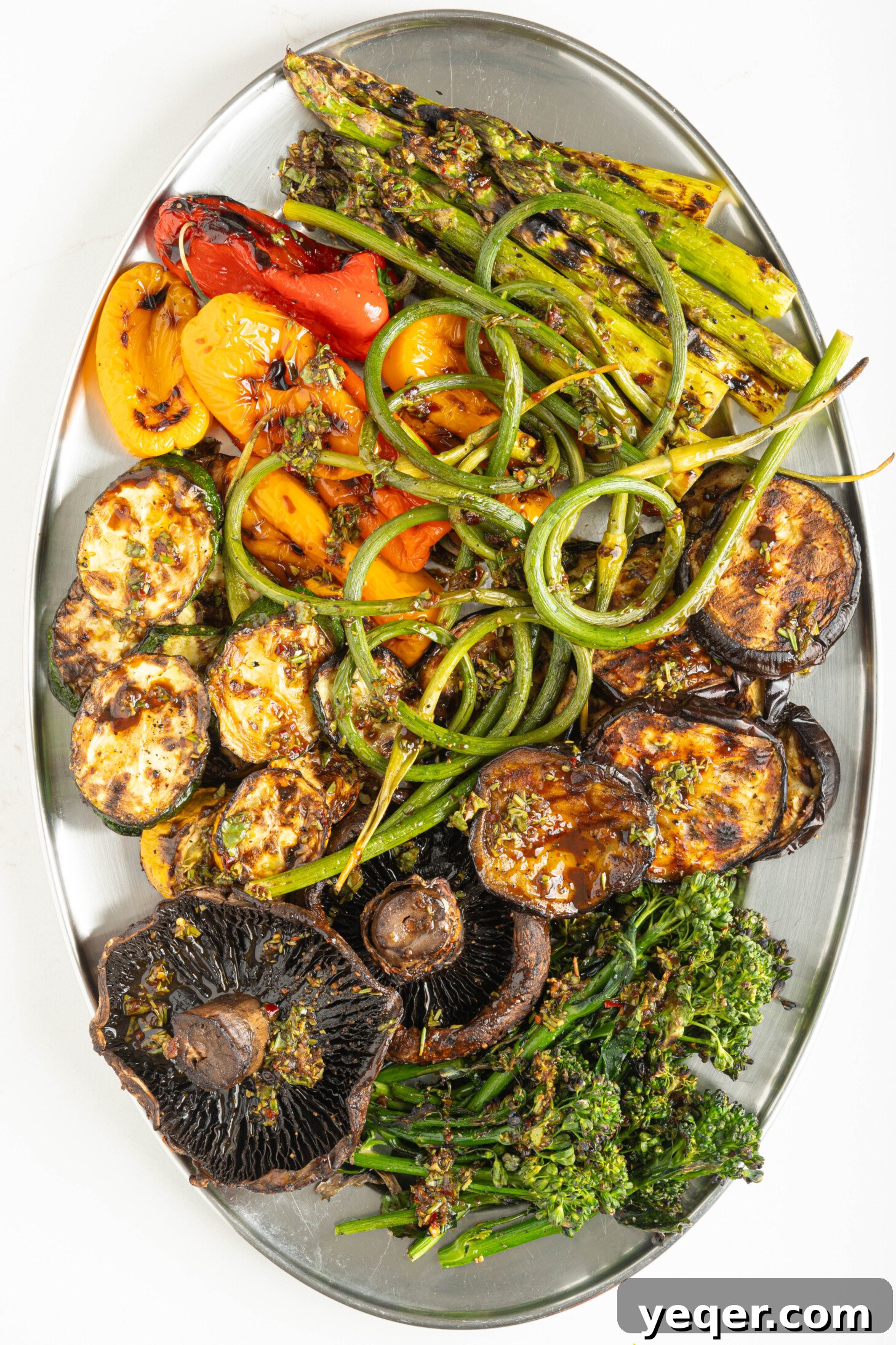 Effortless Grilled Vegetables: 3-Ingredient Marinade 14 A beautifully arranged platter of freshly grilled assorted vegetables, topped with green herbs and ready to be served.