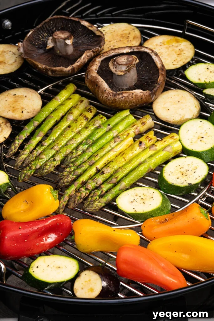 Effortless Grilled Vegetables: 3-Ingredient Marinade 9 Various vegetables, including zucchini, eggplant, and peppers, grilling on an outdoor barbecue, showing developing char marks.