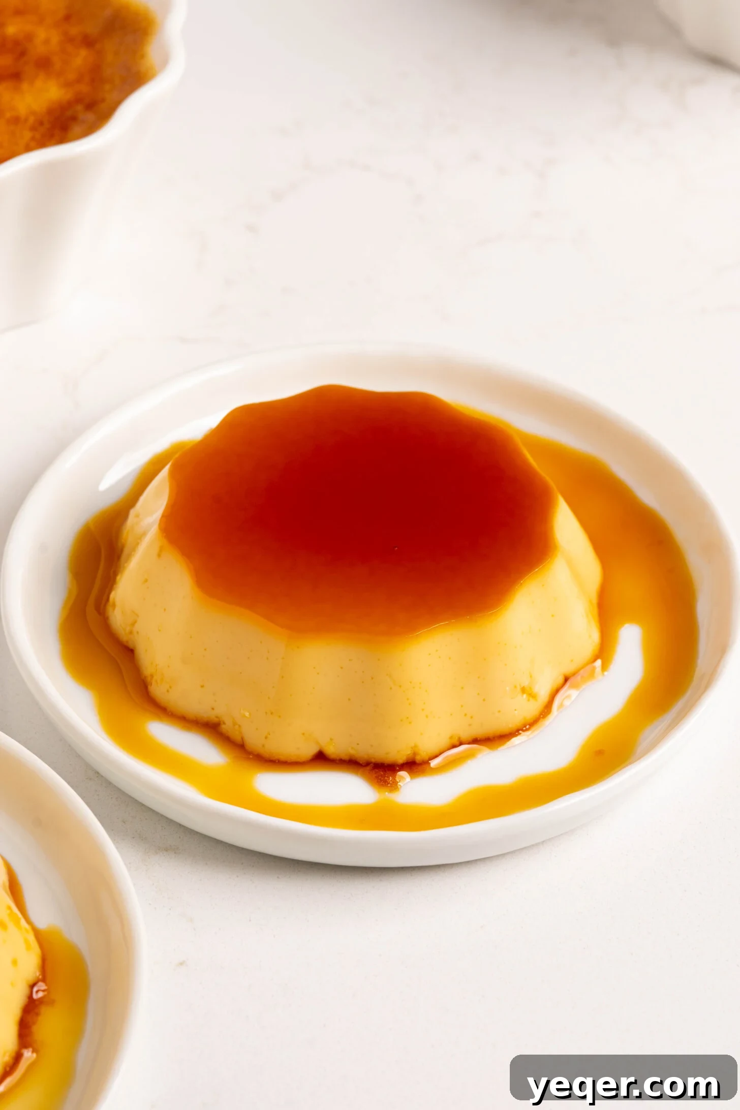 Puerto Rican Sweet Treats 2 A beautifully presented slice of flan on a plate, garnished and ready to be enjoyed.