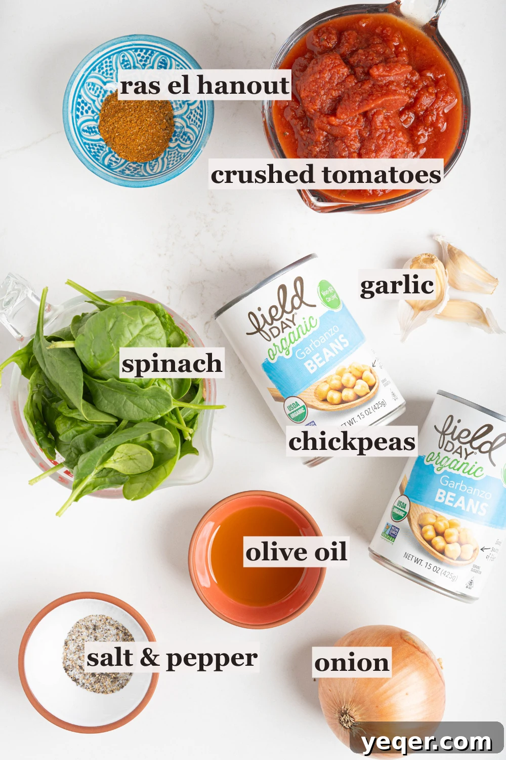 Hearty 30-Minute Moroccan Chickpea and Tomato Stew 3 Bowls of fresh ingredients for chickpea stew, including spinach, olive oil, and various Moroccan spices.