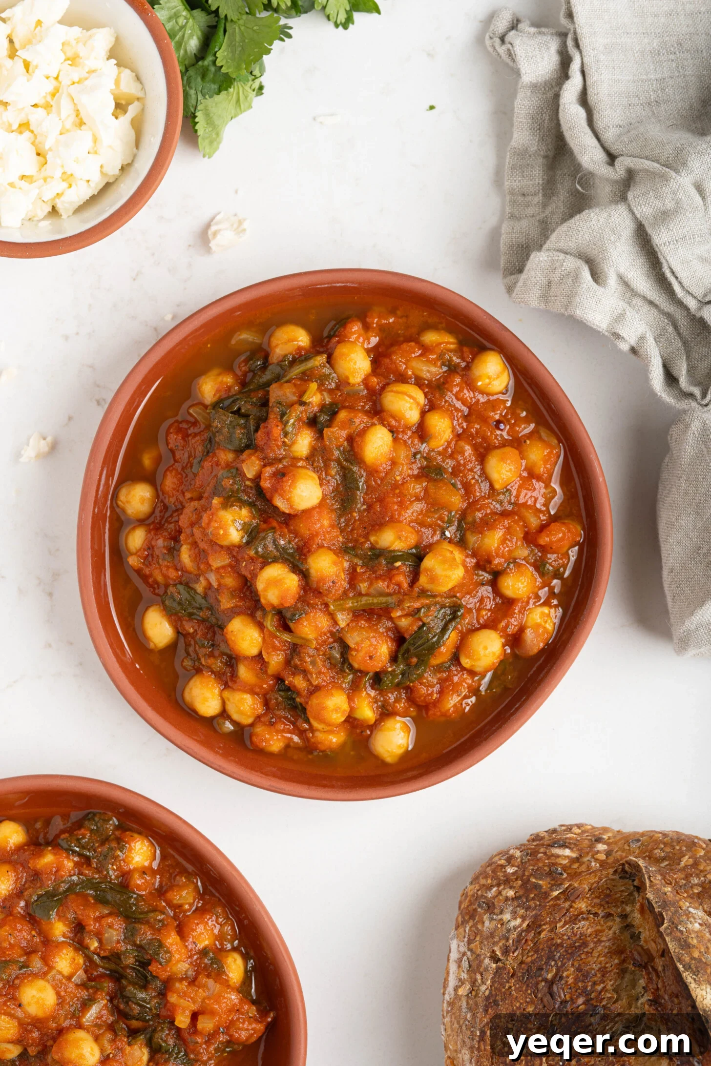 Hearty 30-Minute Moroccan Chickpea and Tomato Stew 8 Close-up of Moroccan stewed chickpeas in a serving bowl, ready to be enjoyed.