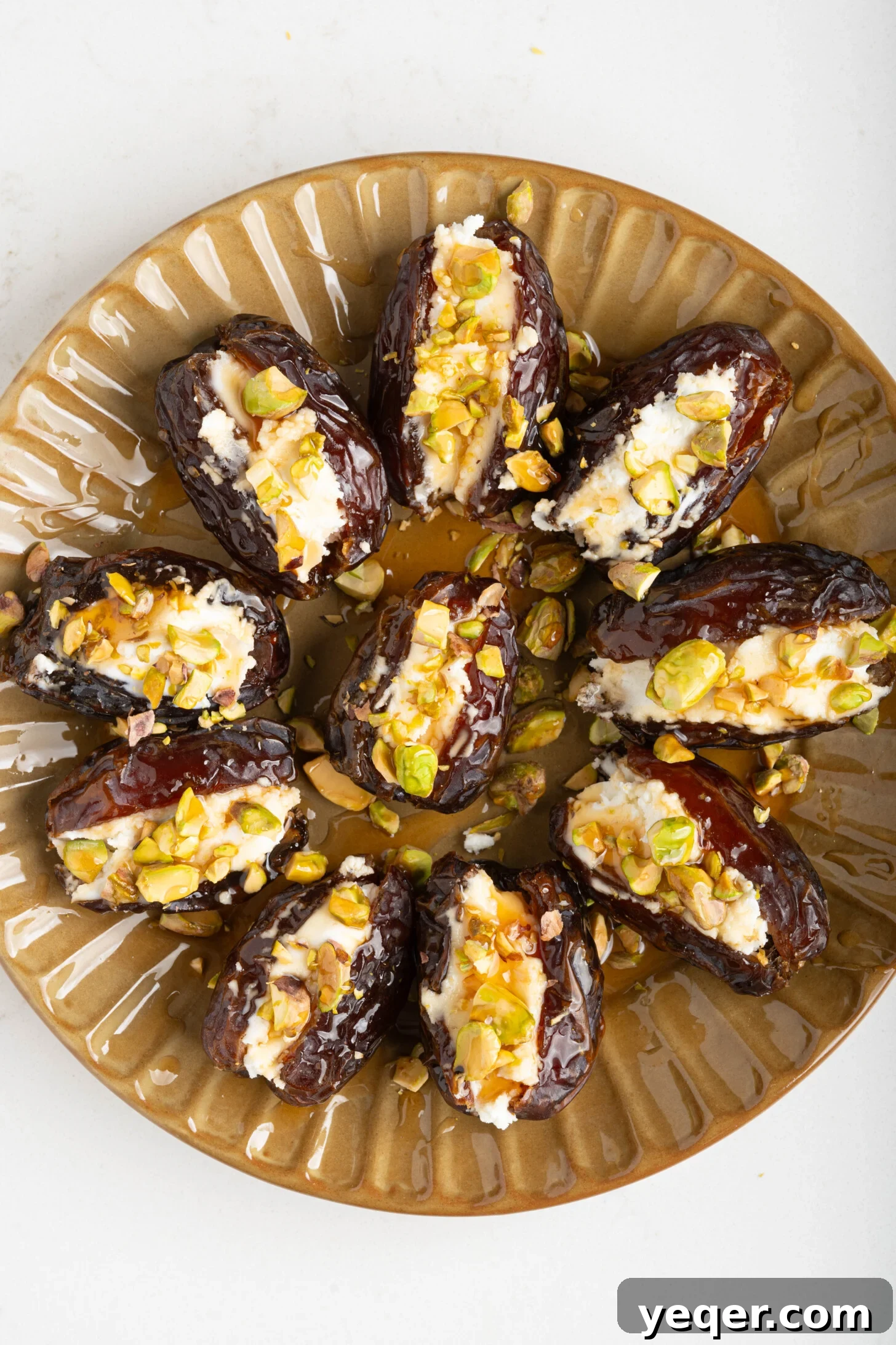 Gourmet Date Medallions: Goat Cheese and Pistachio Bliss 10 A final close-up of a serving platter filled with ready-to-eat goat cheese stuffed dates, garnished beautifully.