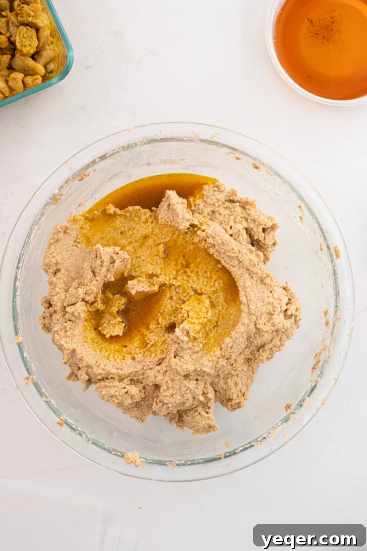 Puerto Rican Pasteles: Savory Meat-Stuffed Masa Delights 12 Smooth pasteles masa in a bowl, showing its uniform color and texture.