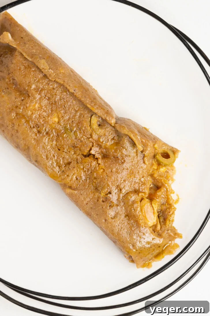 Puerto Rican Pasteles: Savory Meat-Stuffed Masa Delights 3 A beautifully plated Puerto Rican pastel, ready to be enjoyed.