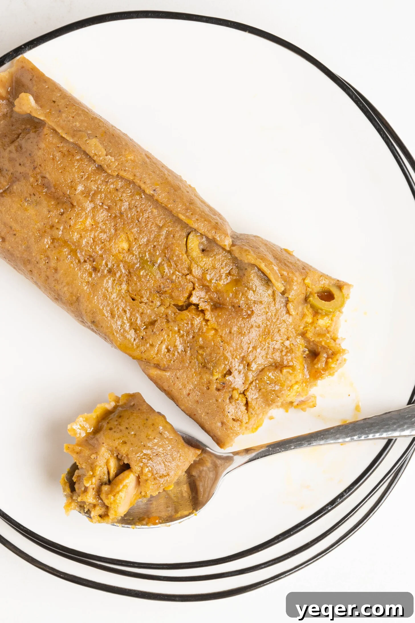 Puerto Rican Pasteles: Savory Meat-Stuffed Masa Delights 24 An artfully arranged plate of Puerto Rican pasteles, garnished and ready to be served.