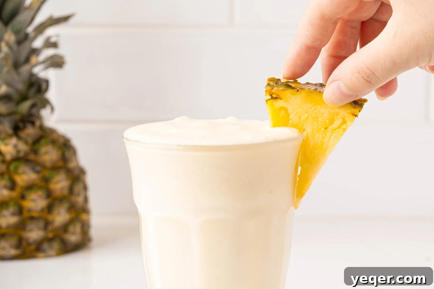 Speedy Piña Colada Morning Escape 8 a piña colada smoothie in a glass
