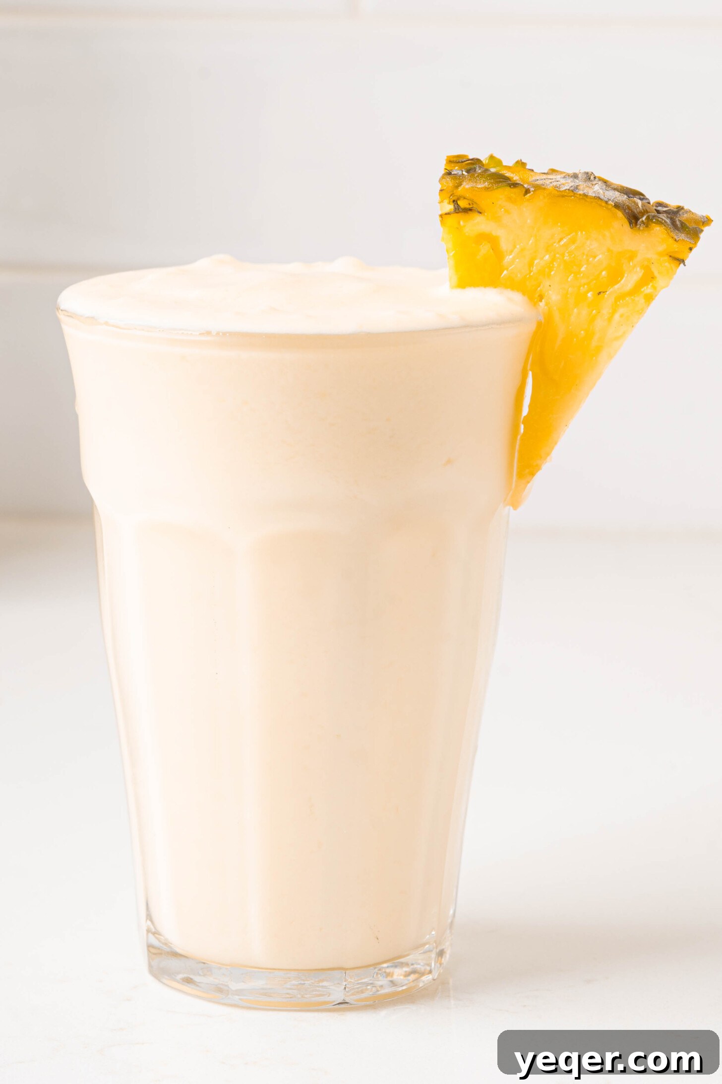 Speedy Piña Colada Morning Escape 9 a piña colada smoothie in a glass