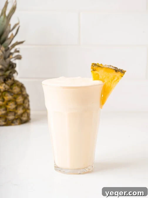 a piña colada smoothie in a glass
