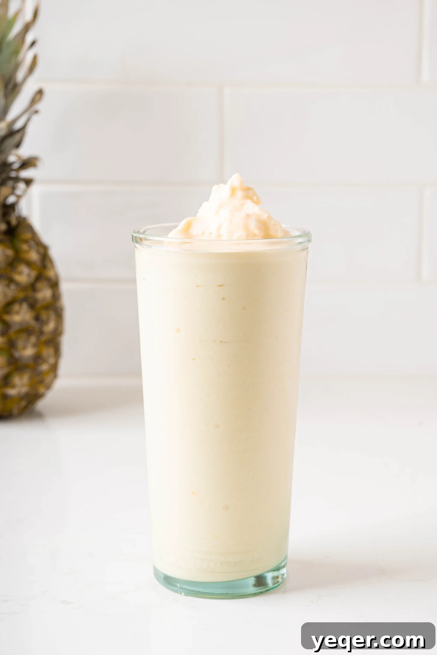 Speedy Piña Colada Morning Escape 3 a piña colada smoothie in a glass