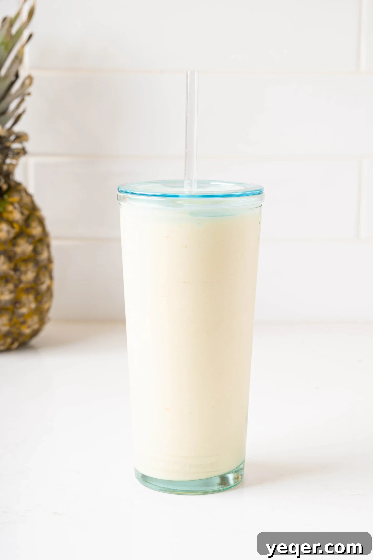 Speedy Piña Colada Morning Escape 4 a piña colada smoothie in a glass