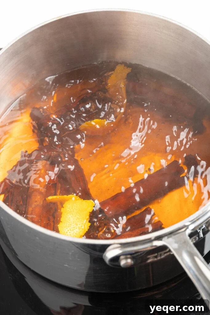 Aromatic Cinnamon Homebrew 5 Cinnamon sticks boiling with water and orange peel.