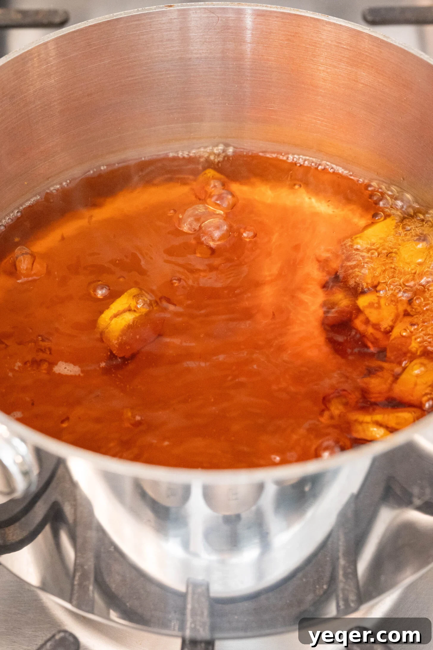 15-Minute Zesty Turmeric Brew 6 turmeric tea boiling in a pot