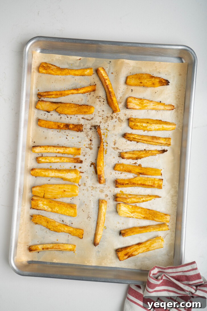 Crispy Baked Cassava Fries Three Simple Ingredients 7 Step 4: Seasoned yuca fries spread on a baking sheet
