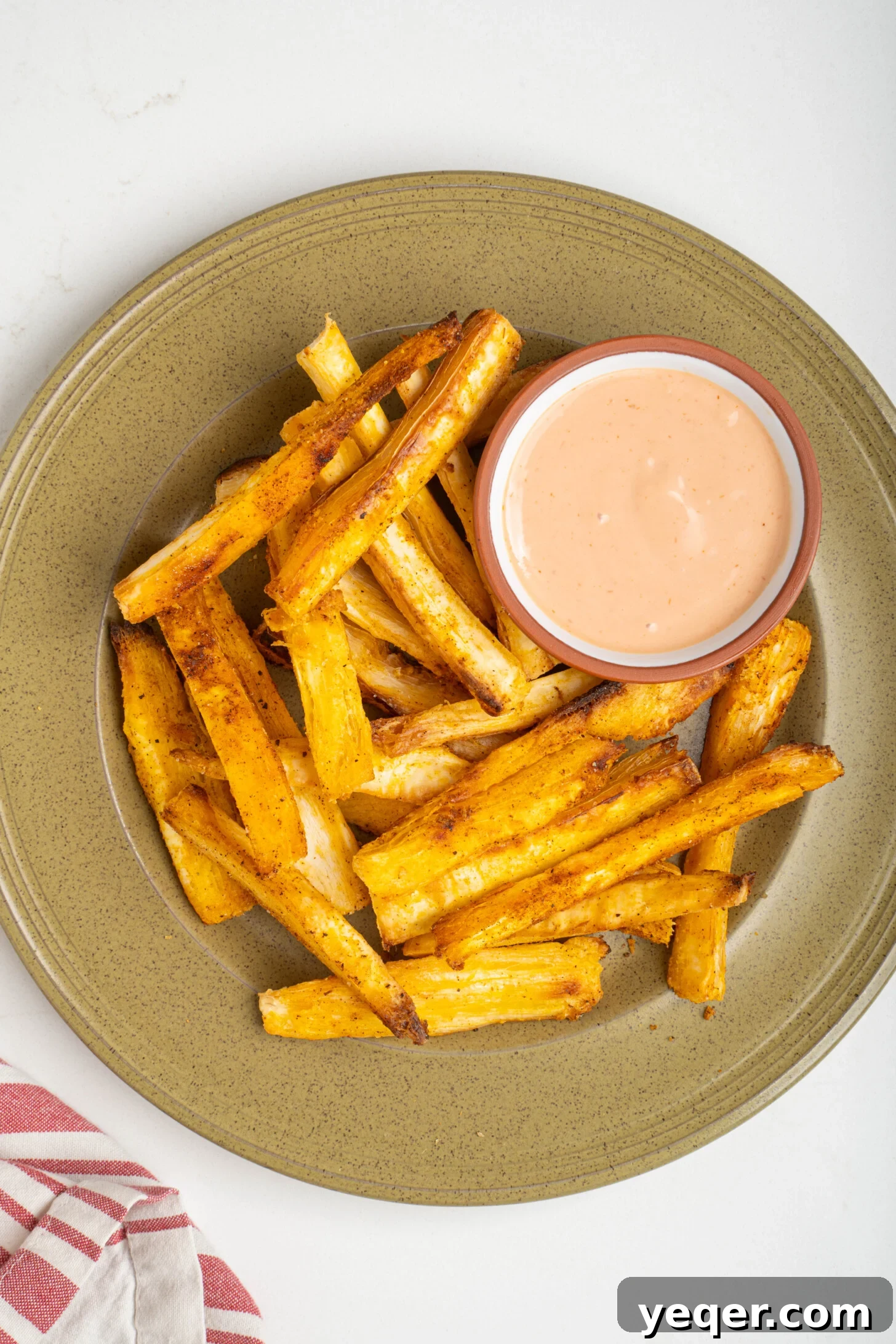 Crispy Baked Cassava Fries Three Simple Ingredients 8 A serving of crispy yuca fries with a blurred background