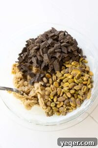 Gluten Free Chocolate Chip Cookie Perfection 2 A bowl of cookie batter with chocolate chips and pistachios