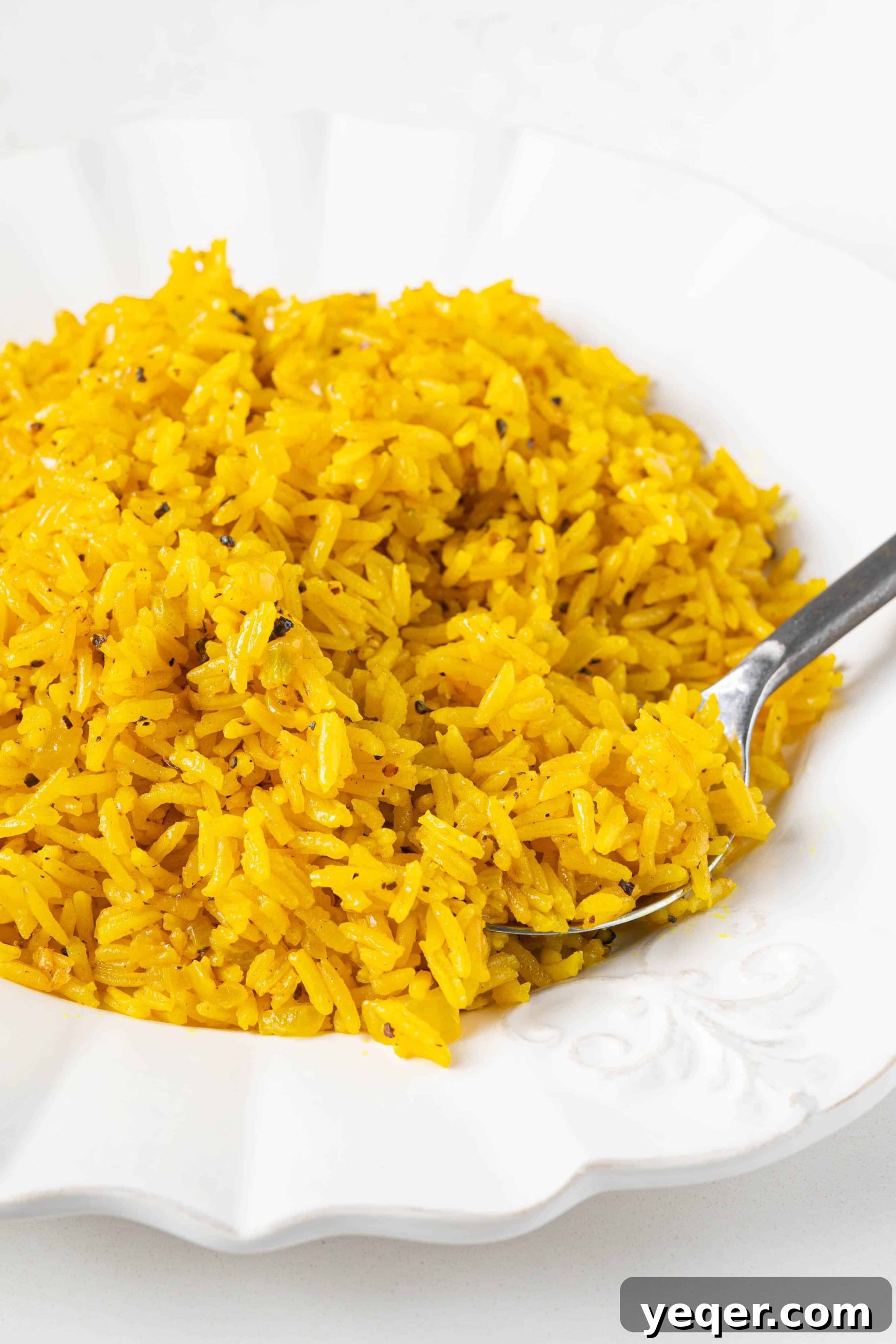 Golden Fluffy Turmeric Basmati Rice 2 turmeric basmati rice on a plate