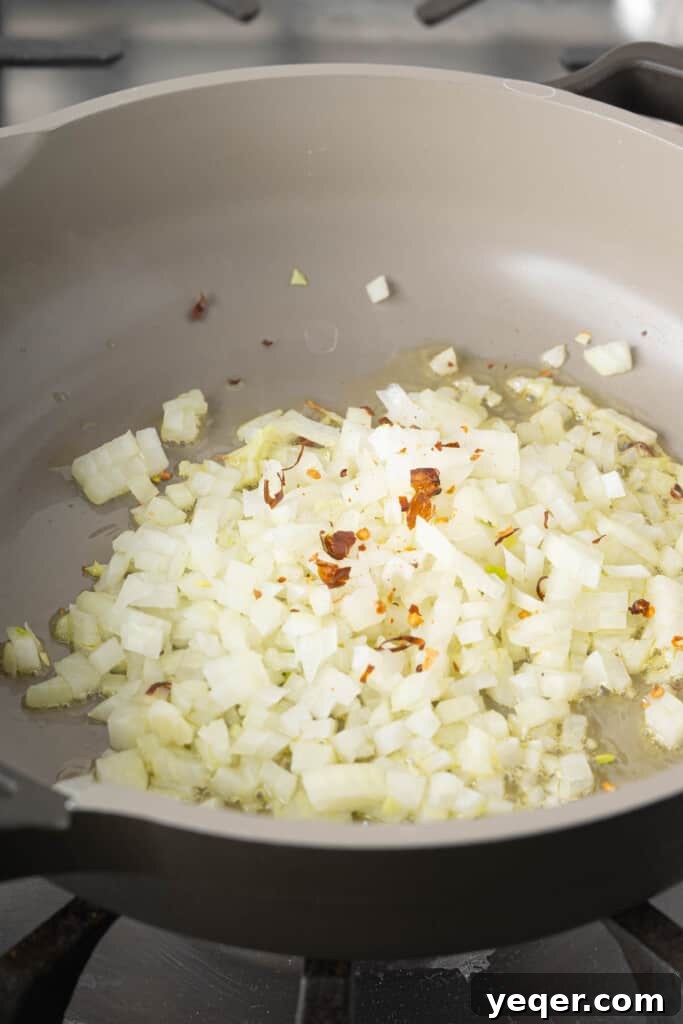 Golden Fluffy Turmeric Basmati Rice 4 Onions and peppers in a pan