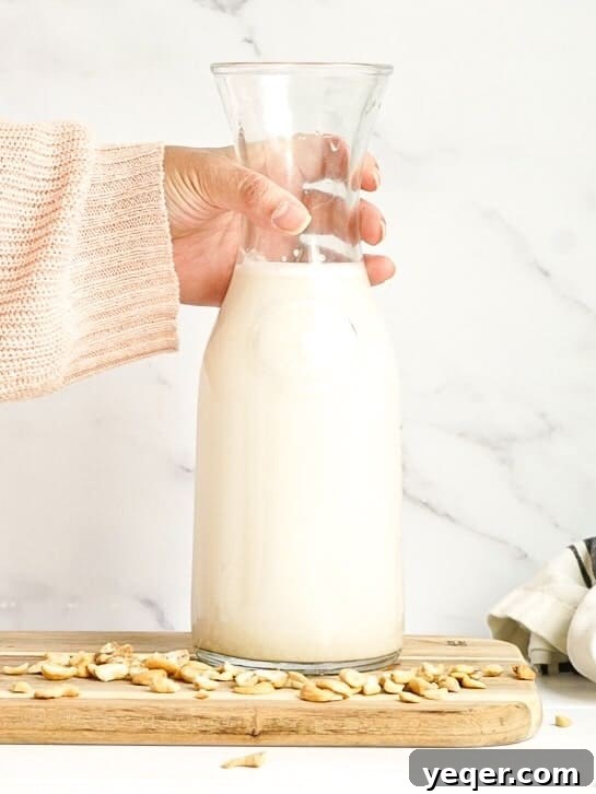 Effortless Homemade Nut Milk 7 A beautifully presented jar of homemade cashew nut milk.