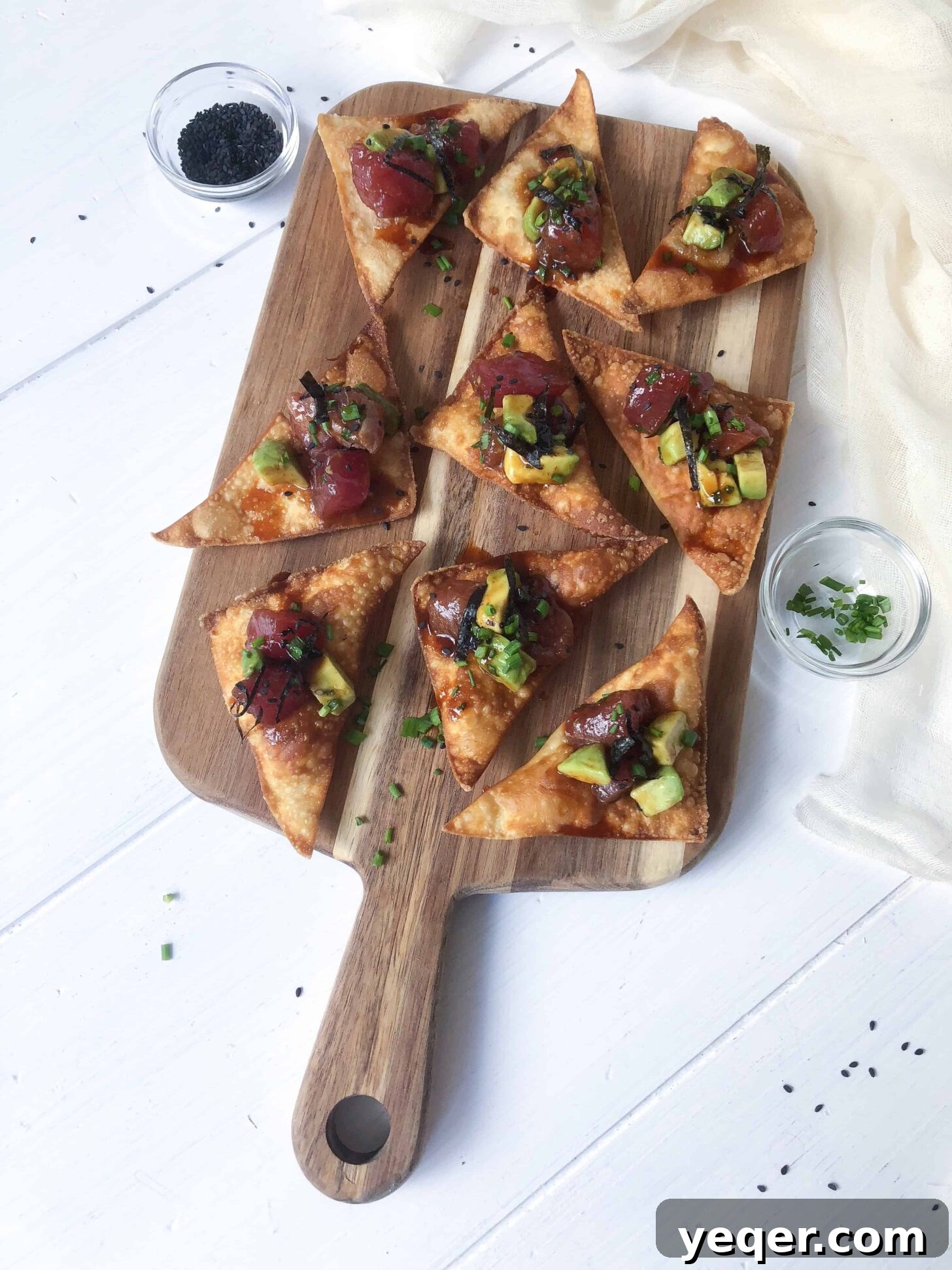 Fresh Tuna Avocado Poke Tapas with Crunchy Wonton Dippers 2 A cutting board with avocado tuna poke tapas