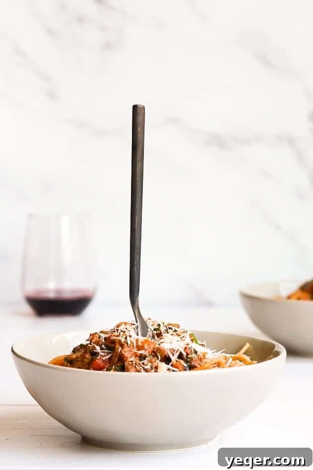 Five Expert Tips for Mouthwatering Food Photos 5 A comforting bowl of spaghetti with a fork, accompanied by a glass of wine, demonstrating the importance of color balance.