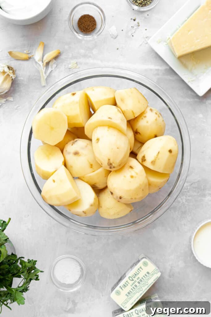 A bowl of peeled and halved potatoes