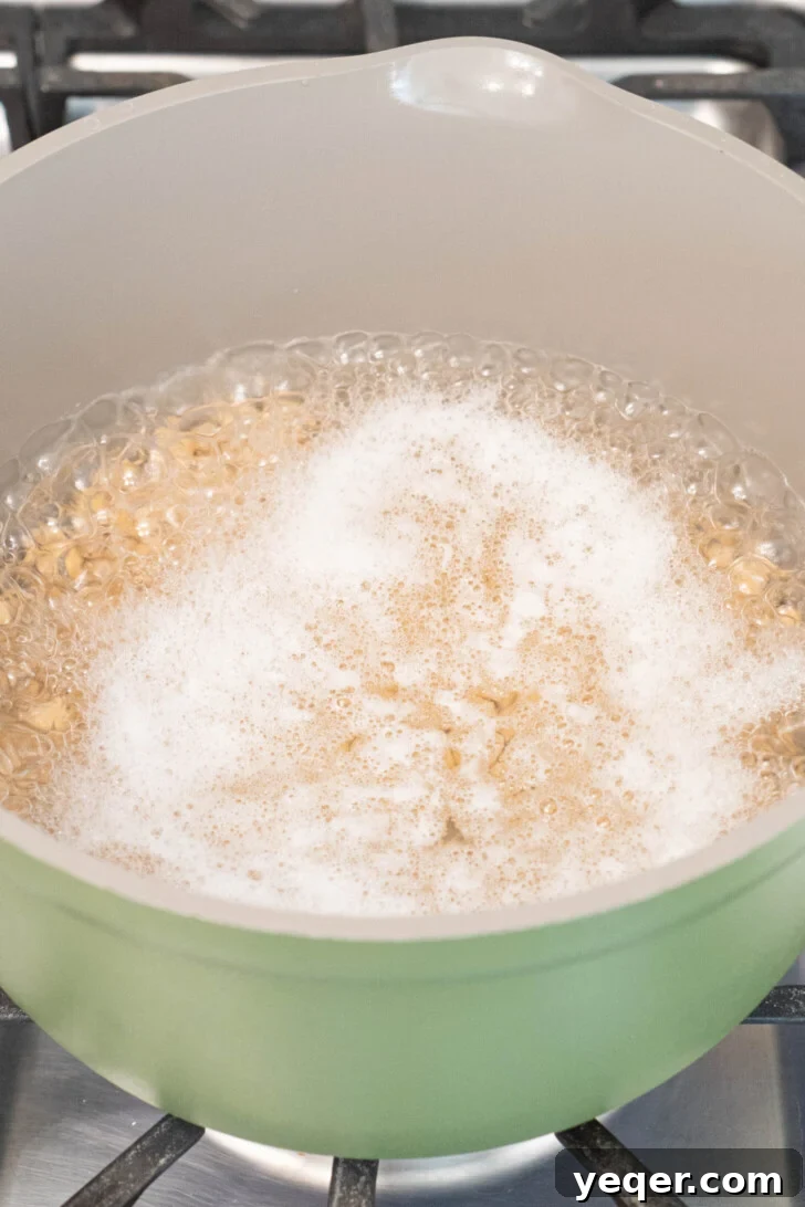 The Foolproof Soak and Boil Method for Perfect Dried Chickpeas 6 chickpeas boiling in a pot