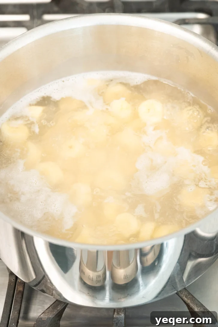 Green Banana Escabeche 6 bananas boiling in a pot