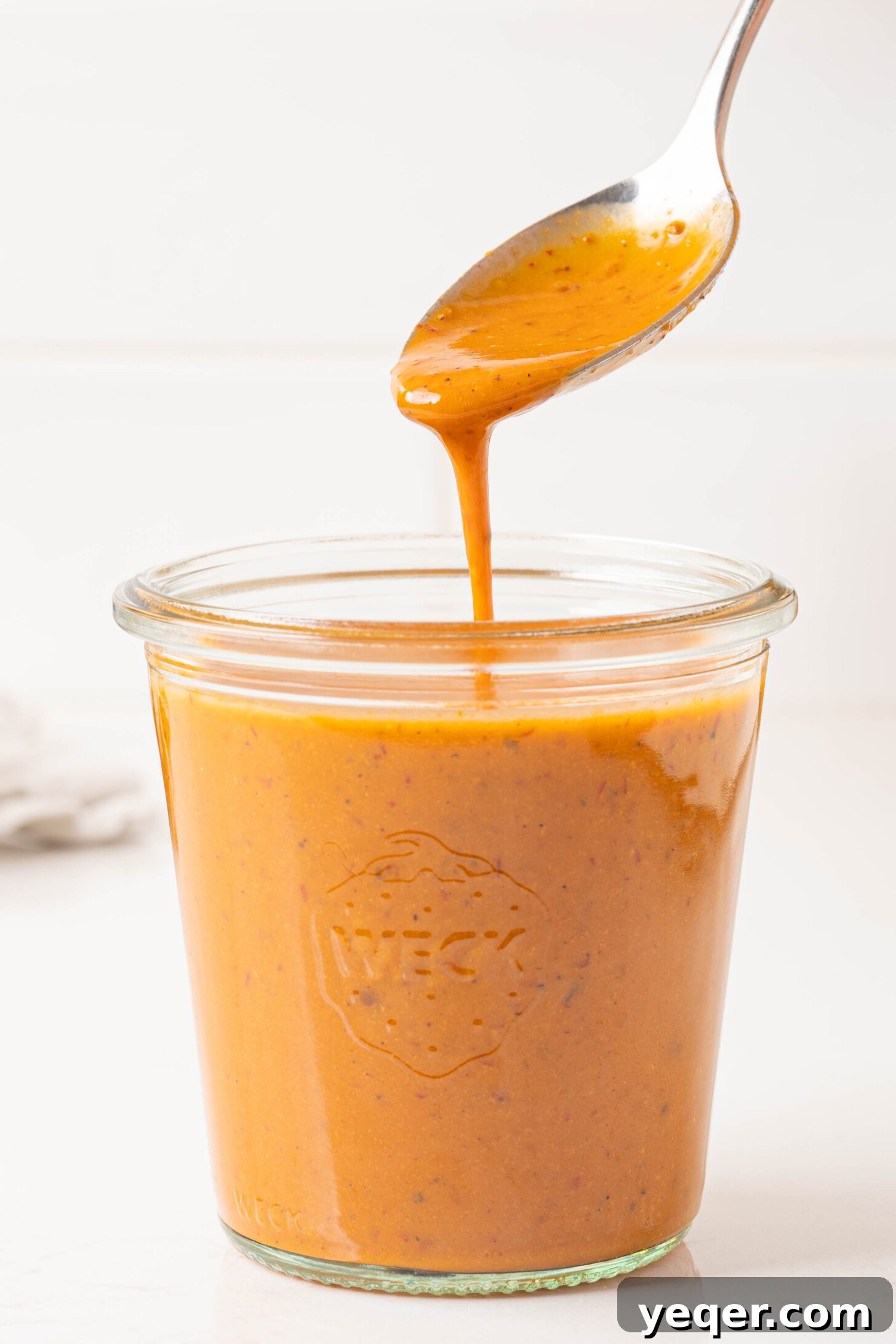 Effortless Chipotle Vinaigrette 10 Chipotle Vinaigrette in a jar with an immersion blender nearby.